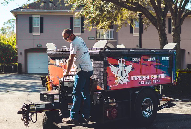 A roofer driving the Equipter 4000 self-propelled trailer