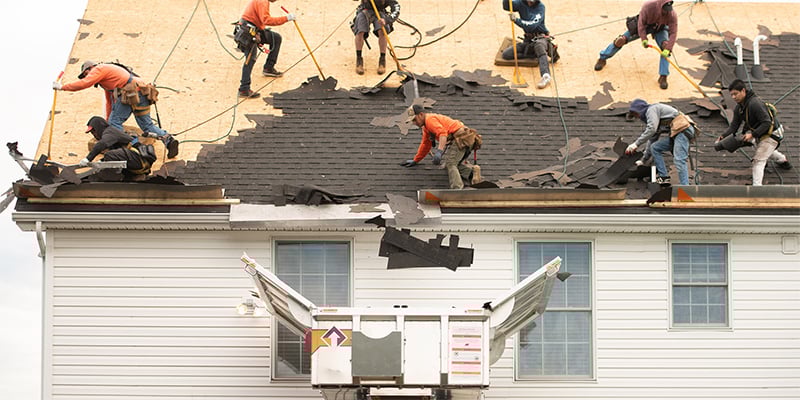A crew working on a roof removal with an Equipter 4000