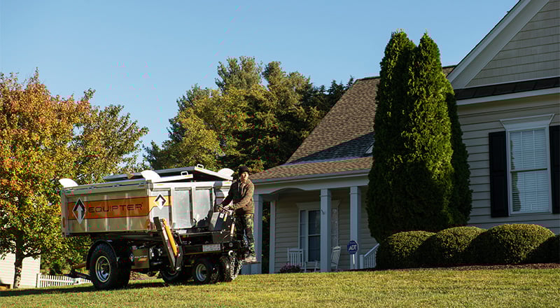 The self-propelled Equipter 4000 driving across a lawn