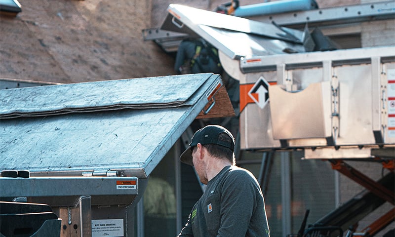 A roofing crew positioning two Equipters on a job