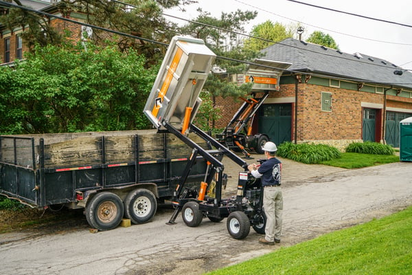 two self-propelled dump containers