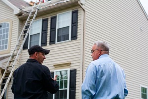 homeowner with a roofer