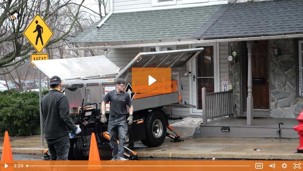 A demolition crew move debris with an Equipter 4000